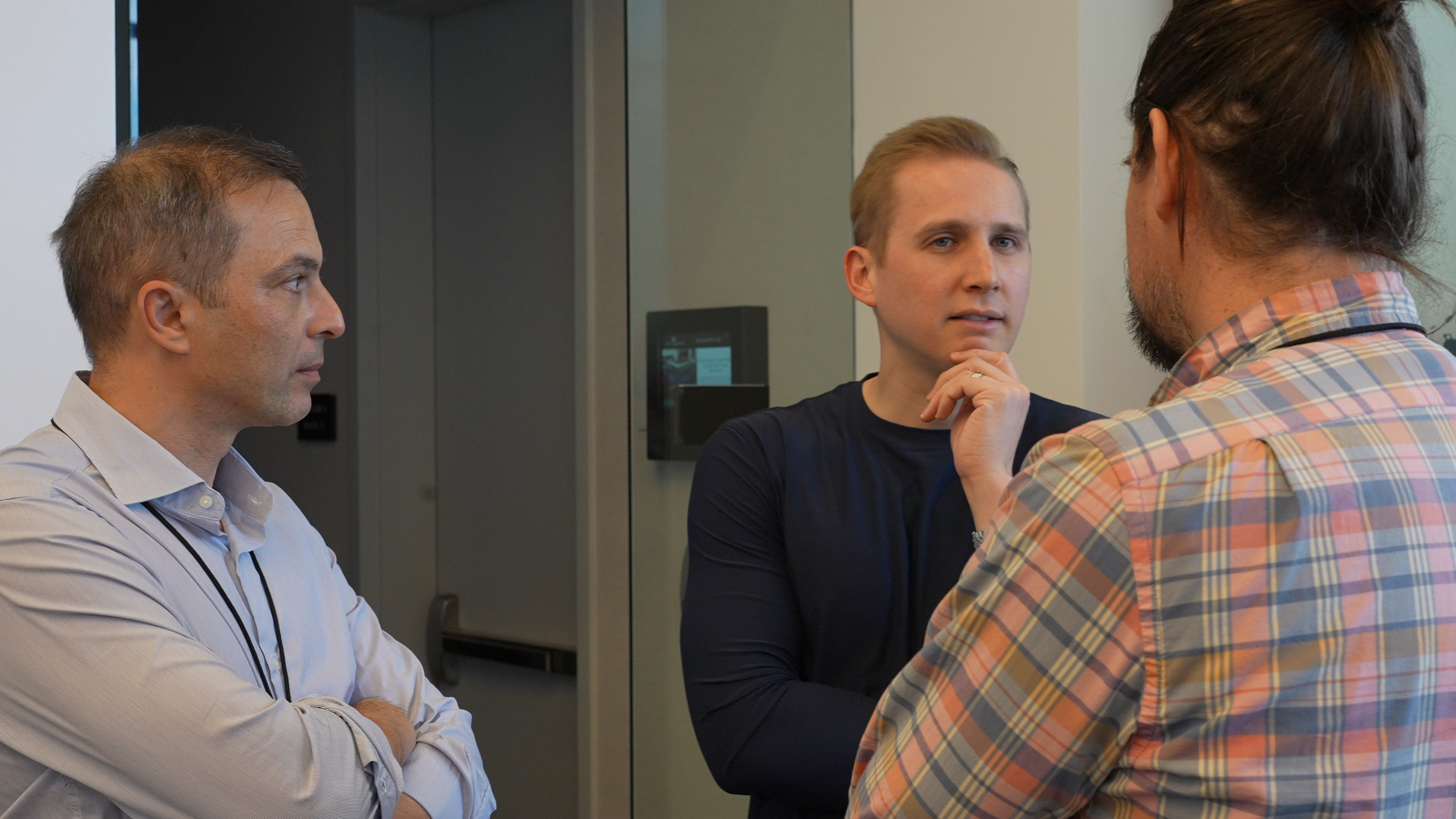 Three executives in discussion